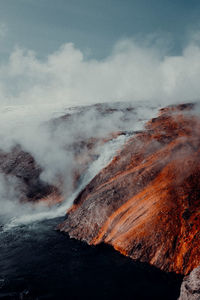 Aerial view of volcanic landscape against sky