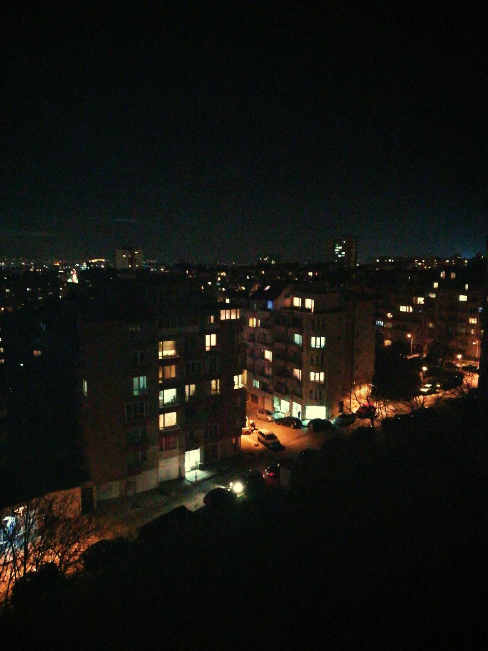 ILLUMINATED CITYSCAPE AT NIGHT