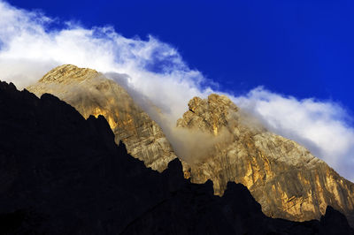 Rocky landscape against blue sky and clouds