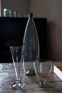 Close-up of glass bottle on table