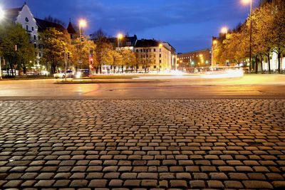 Illuminated city street at night