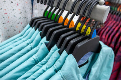 Close-up of clothes rack at store