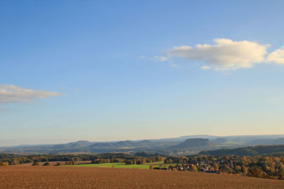 Scenic view of agricultural field against sky