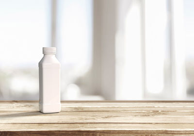 Close-up of glass bottle on table