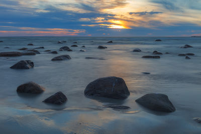 Scenic view of sea against sky during sunset