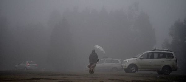 Woman in foggy weather