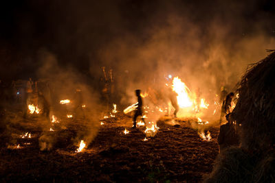 Bonfire on field at night