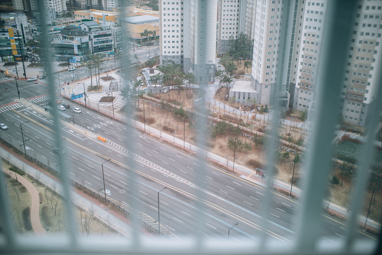 city, architecture, building exterior, no people, high angle view, built structure, transportation, outdoors, road, day, cityscape