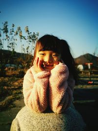 Close-up portrait of a serious young woman