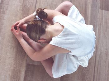 High angle view of woman lying on floor