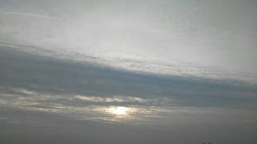 Sun shining through clouds