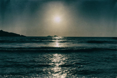 Scenic view of sea against clear sky at night