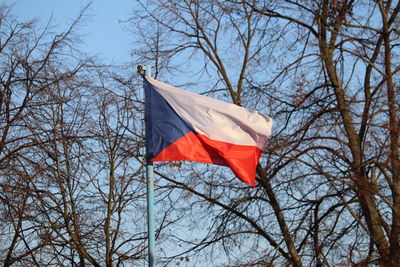 Low angle view of flag against sky