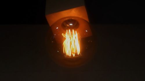 Close-up of illuminated electric lamp