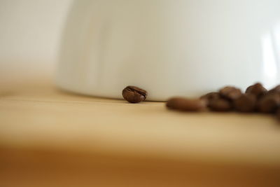 Close-up of coffee beans on table