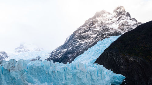 Scenic view of frozen waterfall mountain against sky