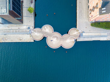 Close-up of heart shape on swimming pool against building