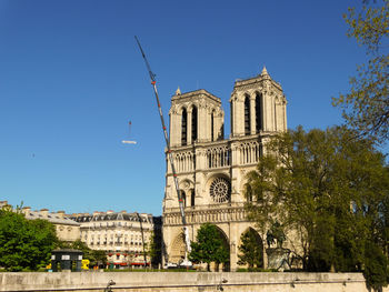 Low angle view of notre dame de paris against clear sky