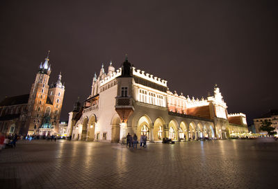 Illuminated buildings in city at night