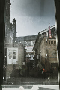 Buildings in city against sky