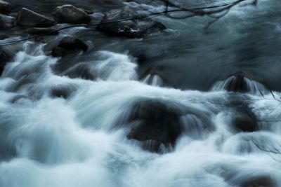 Close-up of water flowing over river