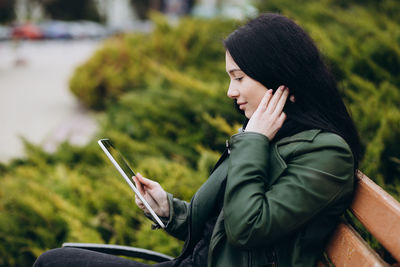 Young woman using mobile phone