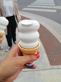Midsection of person holding ice cream cone