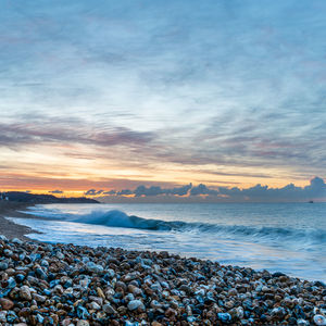 Scenic view of sea against sky during sunset