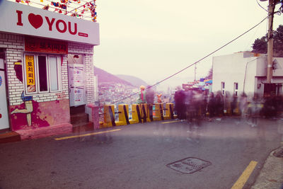 Road amidst buildings in city