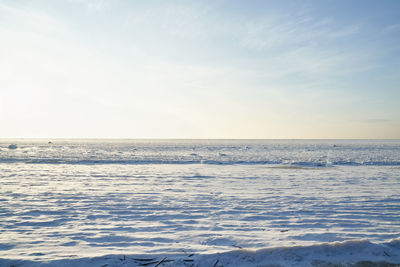 Scenic view of sea against sky during winter