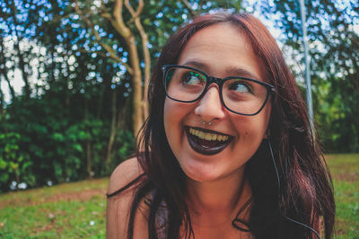 Smiling young woman looking away