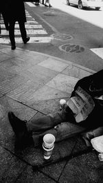 Low section of woman with coffee cup