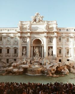 Statue in front of historical building