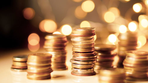 Close-up of illuminated candles on table