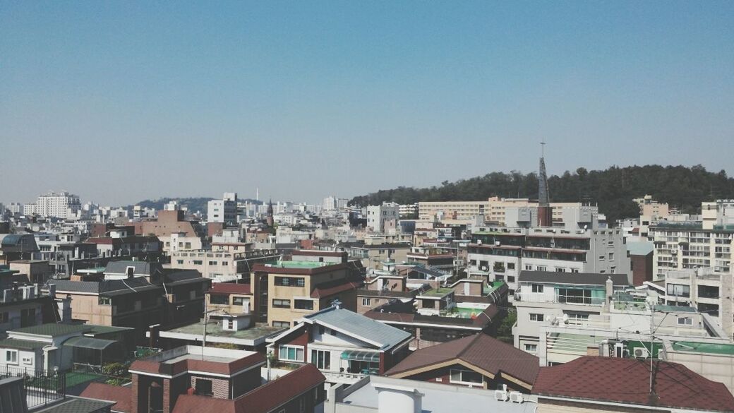 building exterior, architecture, built structure, clear sky, residential structure, residential district, copy space, house, residential building, crowded, city, cityscape, high angle view, town, roof, townscape, blue, day, outdoors, no people