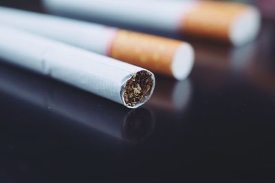 Close-up of cigarette on table