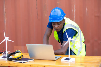 Man working with laptop on table