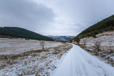 Winter road. country road through forest. travel concept.