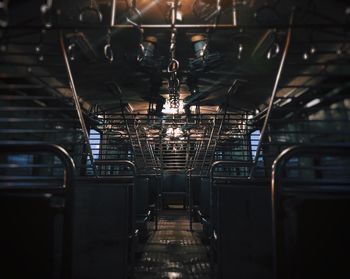 Interior of illuminated railroad station at night