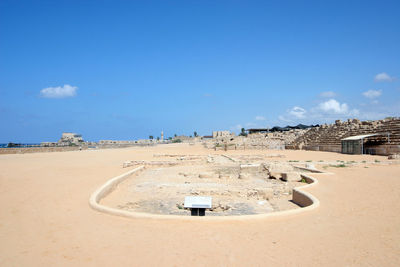 Panoramic view of beach against clear blue sky