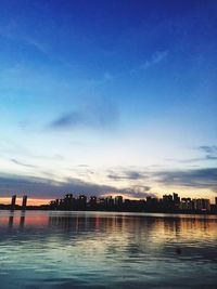 Scenic view of river against cloudy sky