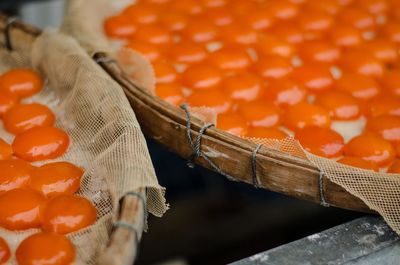 High angle view of orange fruits in basket
