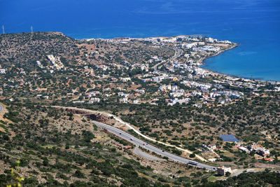 High angle view of cityscape against blue sky