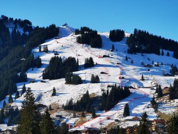 Scenic view of snow covered mountain against sky