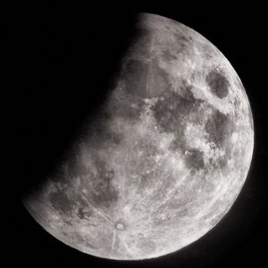 Low angle view of moon against sky at night