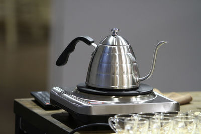 Close-up of tea kettle on stove in kitchen