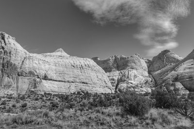 Rock formations on landscape against sky
