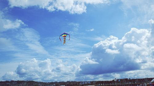 Low angle view of parachute against clear sky