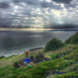 Scenic view of sea against cloudy sky