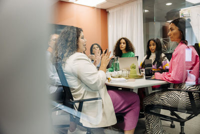 Female entrepreneurs discussing in board room during meeting at office